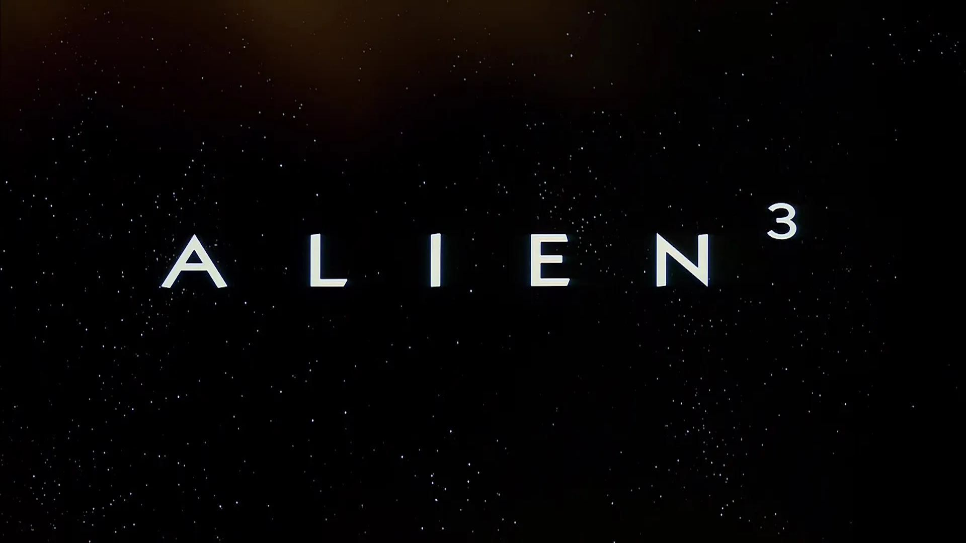 Opening title card for Alien³ against a star-filled backdrop