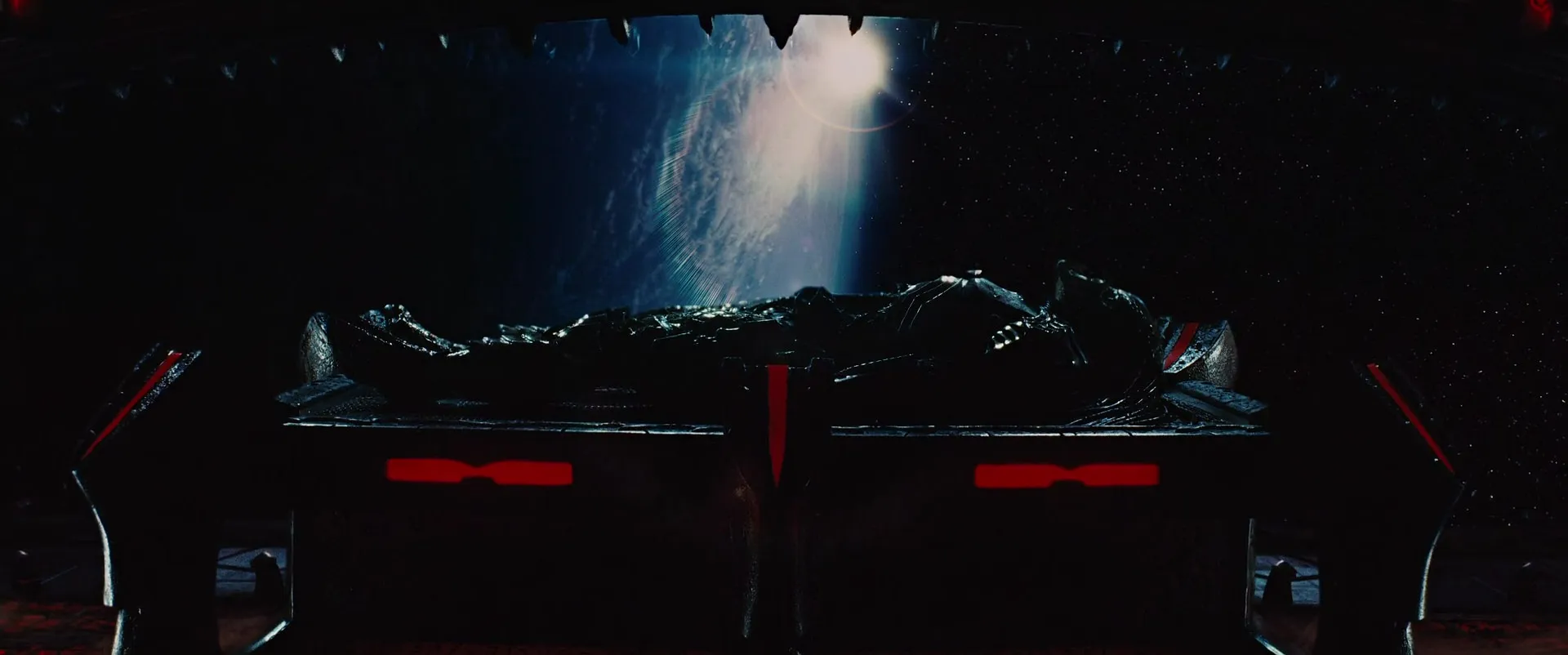 A Predator corpse aboard a ship; Earth looming beyond the viewscreen
